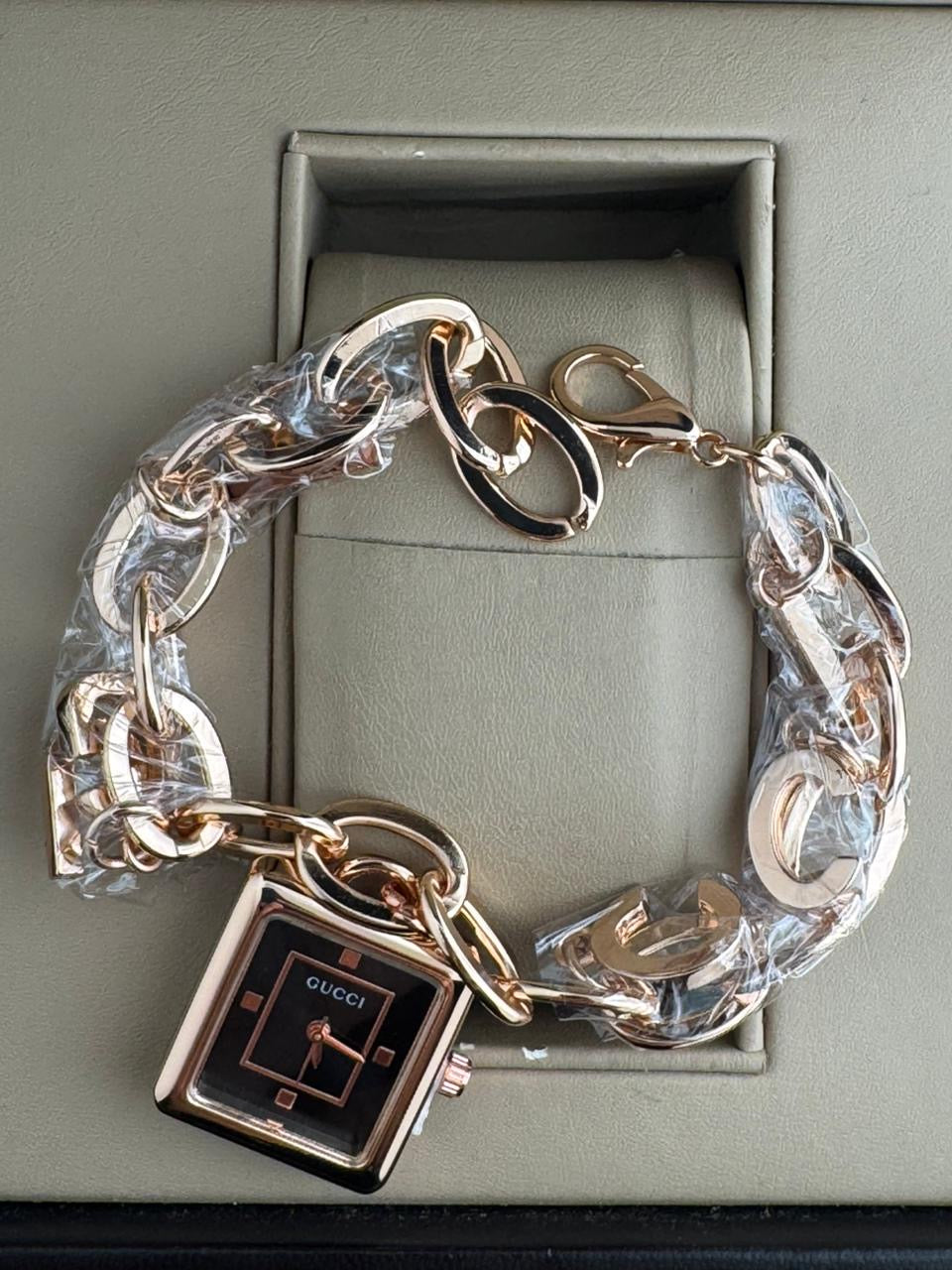 Guci jewelry watch designed in a "charm bracelet"